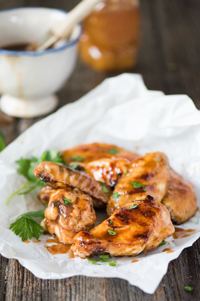 Sticky BBQ Orange Chicken Wings- the honey orange BBQ sauce caramelizes on the chicken as it cooks!
