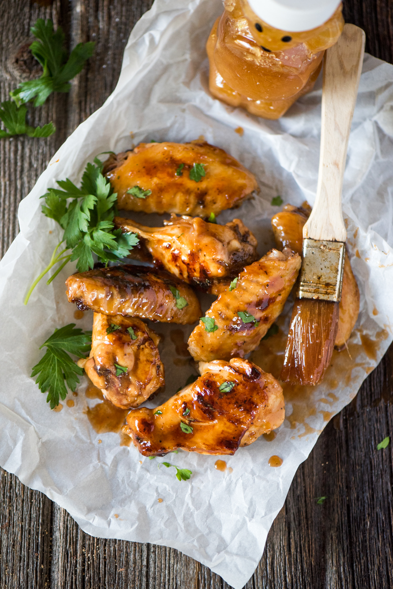 Sticky BBQ Orange Chicken Wings- the honey orange BBQ sauce caramelizes on the chicken as it cooks!