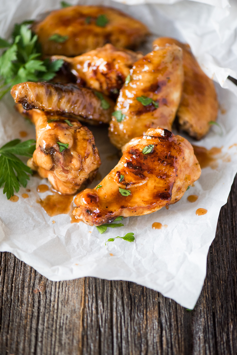 Sticky BBQ Orange Chicken Wings- the honey orange BBQ sauce caramelizes on the chicken as it cooks!